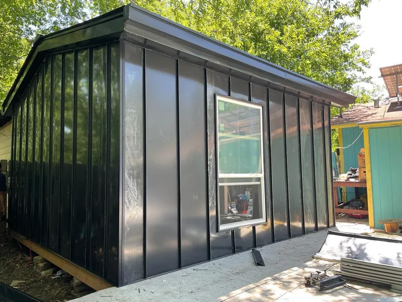 Black standing seam metal wall panels for Roof Inspection in Atlas