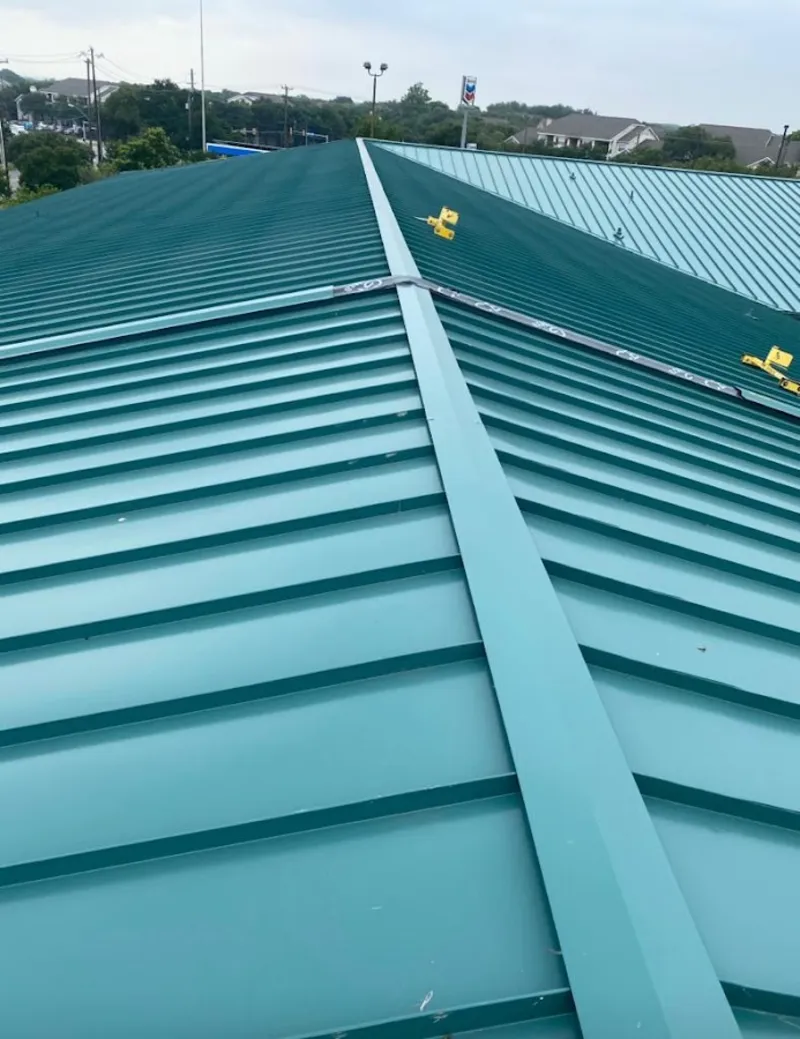 Green commercial metal roof ridge and valley for Metal Roof Repair in Atlas